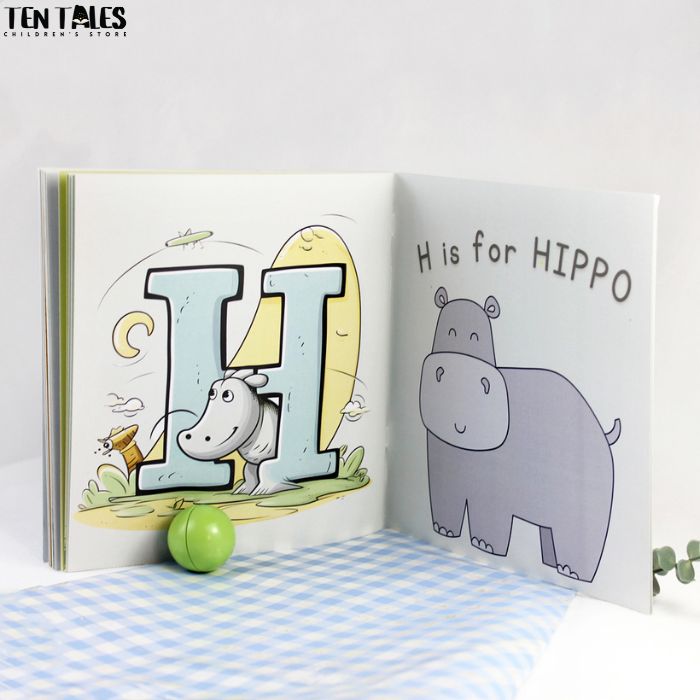 Inside pages of personalised name book for South Asian children showing illustrated letters and characters