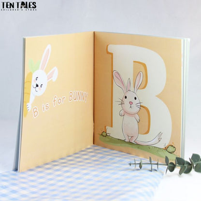 Inside pages of personalised name book for South Asian children showing illustrated letters and characters